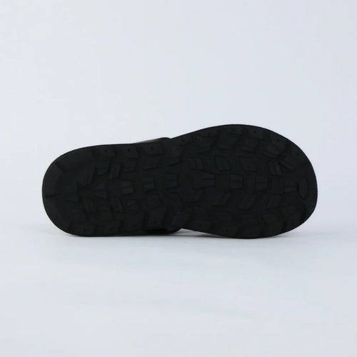 Black sole of a shoe on a light gray background